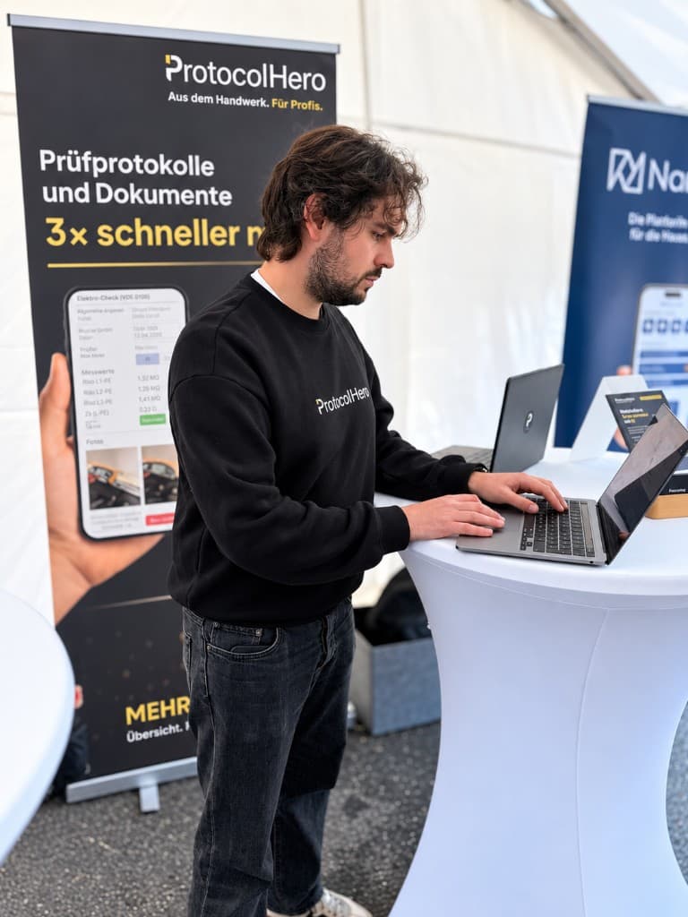 Live demo of ProtocolHero on a laptop in front of the roll-up banner